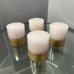 (4) White candles with gold trims beautiful to add as a centerpiece.